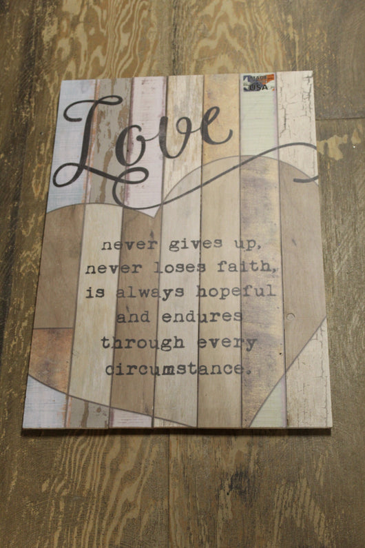 Love Never Gives Up Wooden Sign